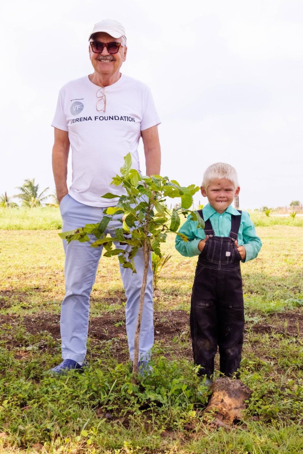 A Verena Foundation tree planting with a child
